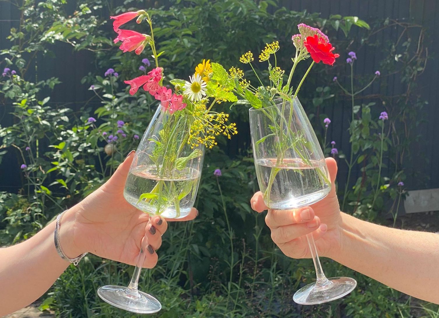 clinking glasses of flowers